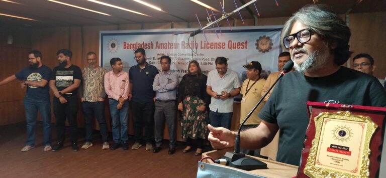 Participants viewing amateur radio equipment